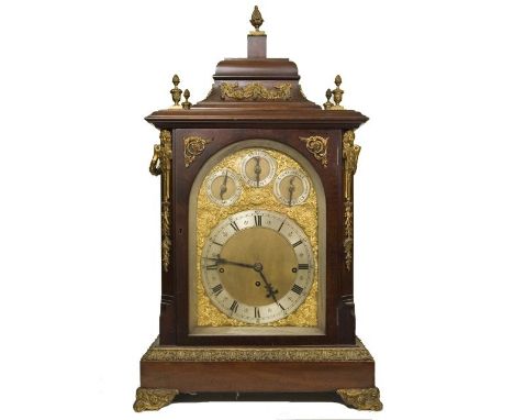 A substantial late 19th century mahogany bracket clock, the mahogany case with ormolu mounts, the arched door enclosing a sil