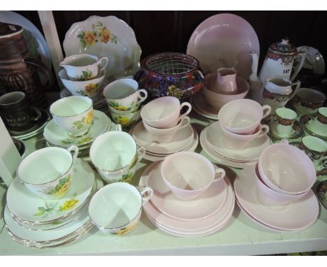 A collection of Wedgwood Alpine Pink pattern tea wares comprising cake plate, milk jug, sugar bowl, seven cups, seven saucers