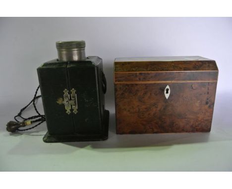 A 19th century chest shaped tea caddy with satinwood inlaid borders and ivory inlay to the lock escutcheon, the hinged lid en