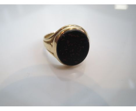 A Victorian hardstone ring, centred with an oval bloodstone, in 18ct gold, size O 1/2