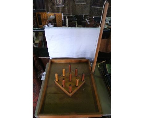 A vintage timber set of bar skittles, the rectangular tray enclosing a side facing raised squared step accommodating nine min
