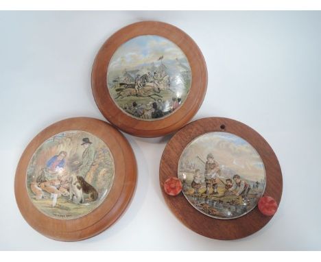 Three 19th century Prattware pot lids showing a horse racing scene with spectators, The Game Bag and Shrimping, all in wooden