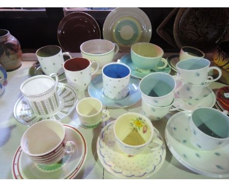 A collection of various Susie Cooper tea and coffee wares including a set of five  Whispering Grass pattern coffee cups and s