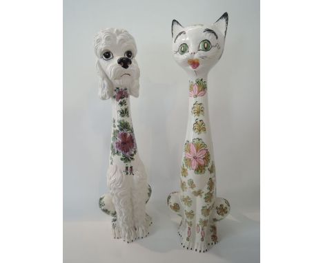 Two large Italian ceramic models, one of a cat, the other of a Poodle, both of elongated form, with painted floral decoration