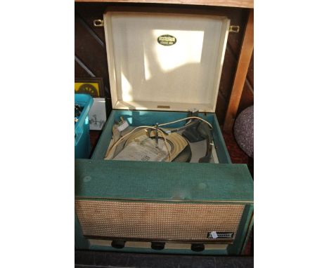 A vintage British made Dansette Conquest Auto record player within a cream and green coloured case