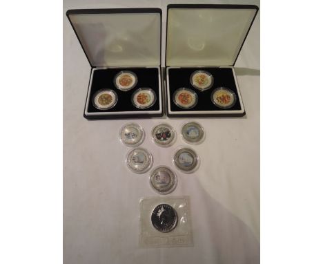 13 Dollars, 12 with enamel detail, and a Canadian dollar