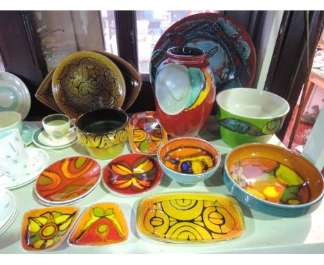 A quantity of various Poole Pottery wares including a red ground vase, various bowls and dishes, etc, mainly with abstract st