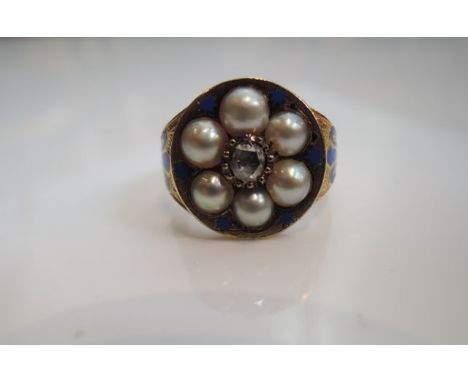 A Victorian ring, centred with an old mine-cut diamond, within a surround of six pearls, the shoulders highlighted with blue 