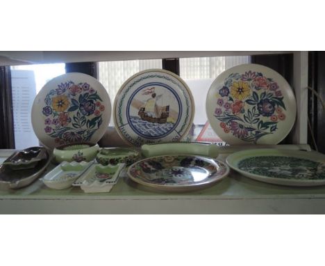 A collection of Poole Pottery wares including a plate with painted galleon decoration inscribed The Ship of Harry Paye, Poole