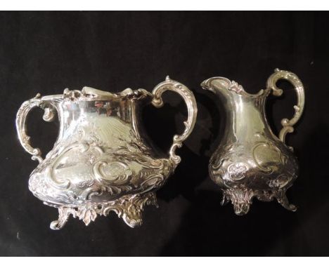 A Victorian silver sugar basin and milk jug, Joseph & Albert Savory, London, 1853, each of bulbous form, chased with flowers,