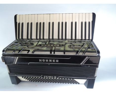 A good quality cased vintage Hohner piano accordion, the case with a faux crocodile skin finish