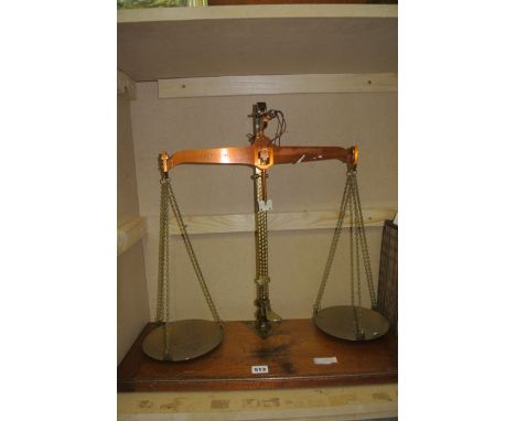 A cased graduated pair of beam scales by De Grave & Co Limited, the larger to weigh 7lb with official stamps dating between 1