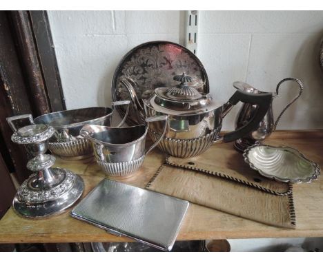 An electroplated teapot with vertical banded embossed decoration, shaped outline with hinged lid with ebonised finial and fur