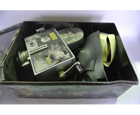 A vintage tin chest containing a substantial vintage ticketing machine, bearing a brass plaque Product Of Setright Registers 