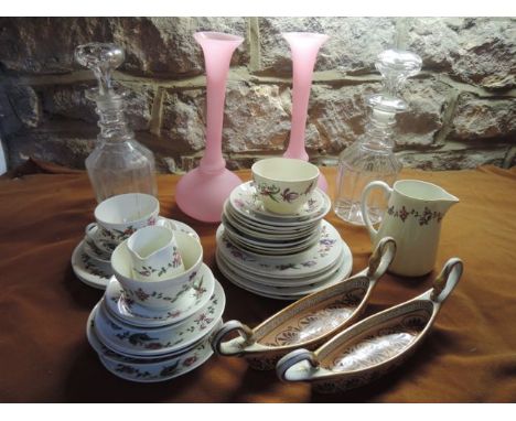 A pair of good quality club decanters with vertical cut decoration, ringed necks and mushroom shaped stoppers, a pair of pink