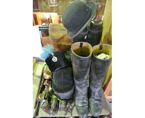 A hunting related collection including two pairs of riding boots, a leaather saddle, a riding hat, a door knocker in the form