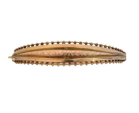 An early 20th century 9ct gold hinged bangle, by Smith & Pepper, hallmarks for Birmingham, 1916, inner diameter 6.1cm, gross 