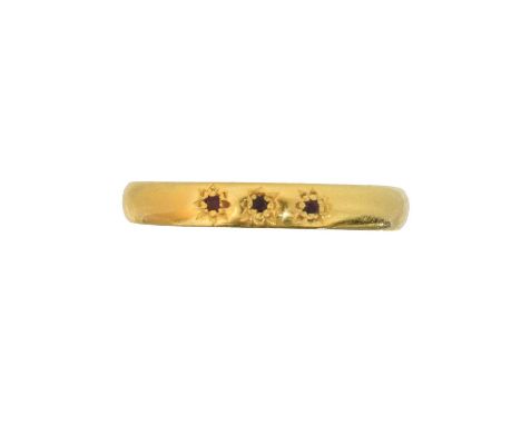 A Victorian 22ct gold ruby band ring, the circular shape ruby line, star set into the polished band, hallmarks for Birmingham