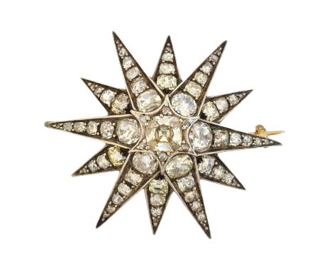 A diamond star brooch, designed as a six ray star set with old cut diamonds and similarly cut diamond spacers, estimated tota