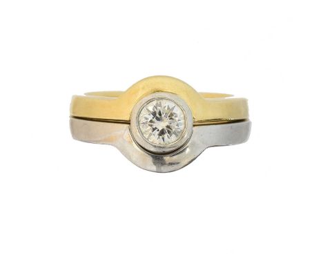 An 18ct gold diamond solitaire ring, the brilliant cut diamond weighing approx. 0.40ct within a collet setting and curved ban