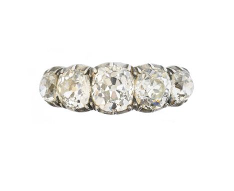 A late Victorian diamond five stone ring, the old cut diamond line within a shared rub-over setting, estimated total diamond 