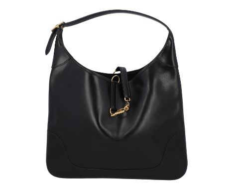 HERMÈS VINTAGE Schultertasche "TRIM". Glattleder in Schwarz mit goldfarbener Hardware. Klassisches Modell mit dekorativem Ver