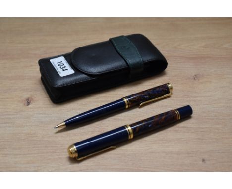 A Pelikan M800 piston fill fountain pen and ballpoint pen in Stone Garden design having Pelikan 750 18c nib