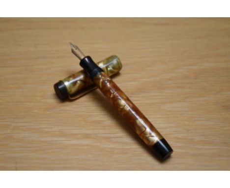 A Parker Duofold Special button fill fountain pen in pearl and gold with single band to the cap having Parker 14k England 35 
