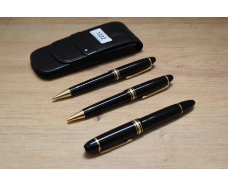 A Montblanc Meisterstuck 149 piston fill fountain pen, ballpoint pen and propelling pencil in black with gold trim, the fount