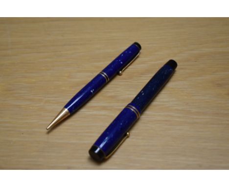 A Parker Duofold Special button fill fountain pen and propelling pencil in lapis lazuli with two bands to the cap having 14ct