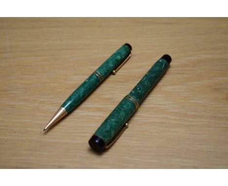 A Parker Duofold Special button fill fountain pen and propelling pencil in jade green with two bands to the cap having  Parke