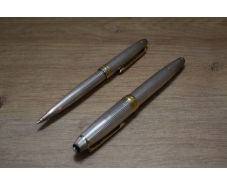 A Montblanc Meisterstuck piston fill fountain pen and propelling pencil in 925 silver with gold trim fountain pen having 4810