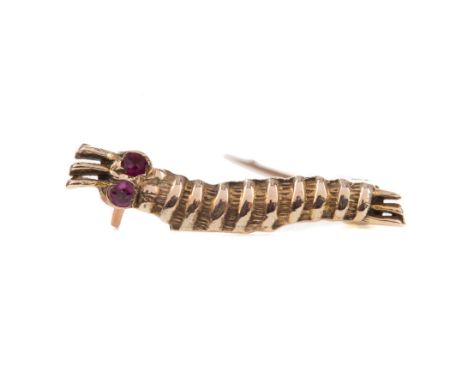 RARE WWII 'CATERPILLAR CLUB' GOLD AND RUBY BROOCH, modelled as a silk worm with ruby eyes, 19mm long, engraved to the reverse