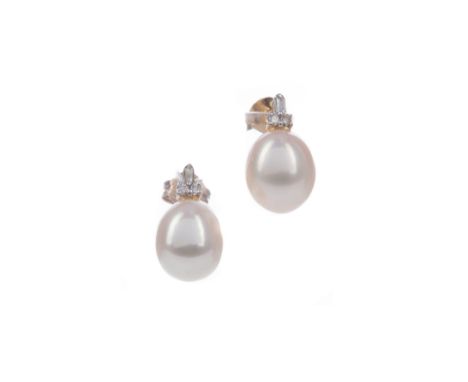 PAIR OF PEARL AND DIAMOND EARRINGS, the oval pearls topped by baguette and round brilliant cut diamonds totalling approximate