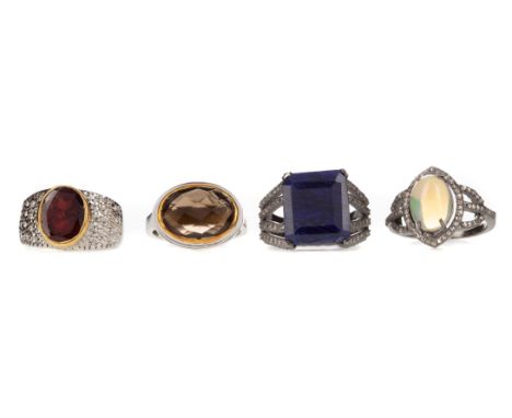 FOUR GEM SET RINGS, including sapphire, smoky quarts, opal and ruby, some with diamond accents, each in silver (4)