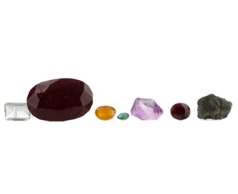 **SEVEN CERTIFICATED UNMOUNTED GEMSTONES, including a 20.39 carat green amethyst, 83.14 carat emerald, 496.15 carat ruby, 21.