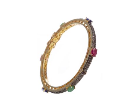 GEM SET AND DIAMOND BANGLE, with rubies, sapphires and emeralds interspaced by diamonds, silver gold plated