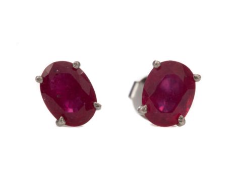 PAIR OF TREATED RUBY STUD EARRINGS, set with oval treated rubies, in silver, 1.7g