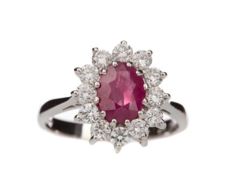 RUBY AND DIAMOND RING, the oval ruby of approximately 1.20 carats, within a halo of round brilliant cut diamonds totalling ap