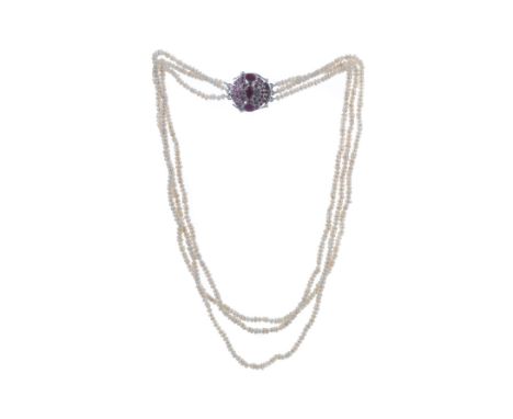 PEARL NECKLACE, formed by three strands, 45cm long, with ruby clasp marked 925