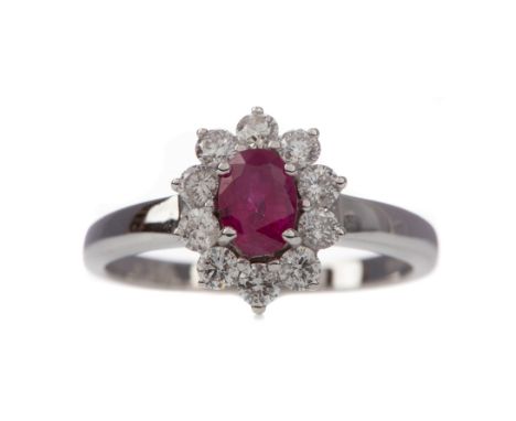 CERTIFICATED RUBY AND DIAMOND CLUSTER RING, the oval ruby of approximately 0.50 carats, with evidence of thermal enhancement,