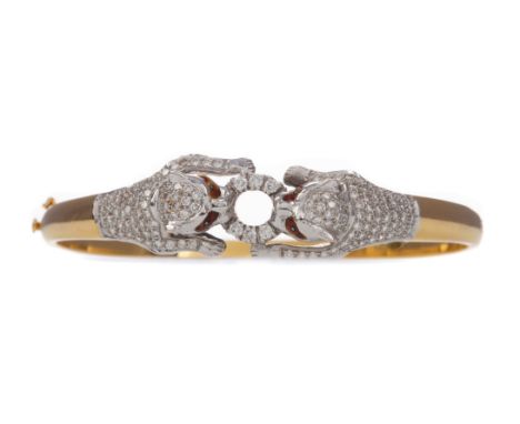 DIAMOND SET PANTHER BANGLE, depicting two diamond set panthers with a diamond set circle between their jaws, marked 18K, 59mm