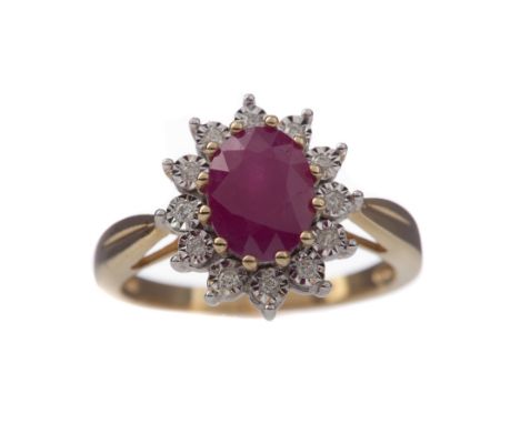 RUBY AND DIAMOND CLUSTER RING, set with an oval ruby of approximately 1.86 carats, within an illusion set diamond halo totall