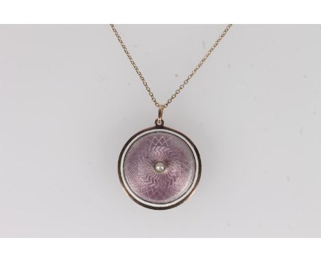 Edwardian 15ct gold and pink guilloché enamel locket pendant, centred with a split pearl within enamel and white band, on a f