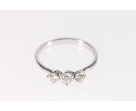 18ct white gold diamond three stone ring, the central 0.3ct diamond flanked by slightly smaller stones, ring size R, 3g.