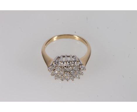 18ct gold and diamond cluster ring, the twenty-nine small round brilliant cut diamonds pavé set in a beehive form, tapered sh