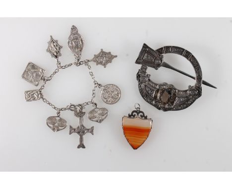 Scottish silver penannular brooch with Celtic designs and set with faceted stone by Celtic Art Industries, Edinburgh hallmark