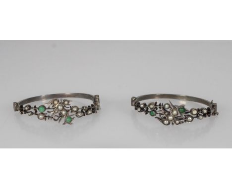 Pair of Chinese hinged silver bracelets decorated with pearls and jade, with a bird to the centre of the decorative top band,