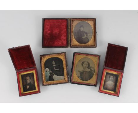 Group of five early photographs ambrotypes daguerrotypes to include a portrait of a young girl with rabbit and dog, three por