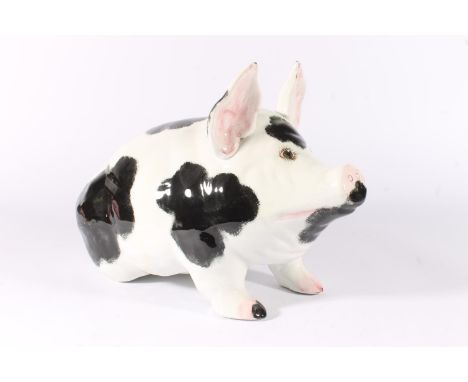 Wemyss Pottery pig, sponge decorated in patches of black with pink highlights, marked to base 'Wemyss Made in England', L41cm